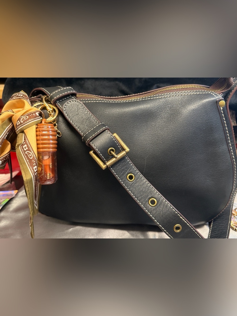 HOBO Black Leather Saddle Handbag with Tan Logo Patch